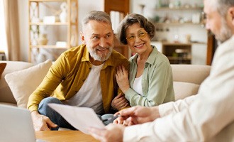 an older couple talking with another person