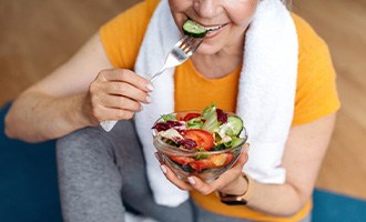 a person enjoying a healthy meal after exercising
