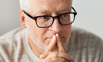 Man with glasses concentrating