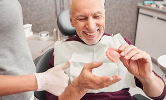 Man after receiving dentures in Westminster 