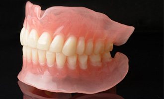A full set of dentures on a table  