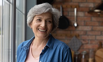 Woman with dentures in Westminster