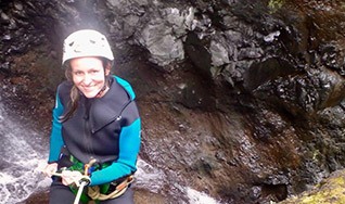 Dr. Bancroft outdoors rock climbing