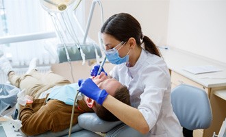 a dentist treating a patient