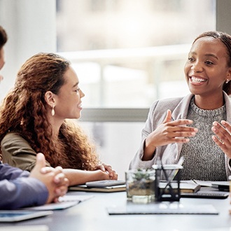 Female professional appearing confident in front of peers