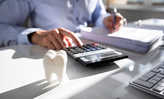 close up of man with pen and calculator