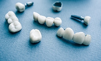 Types of dental implants on blue background