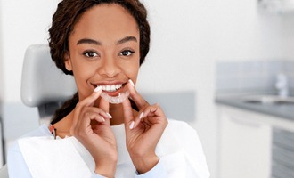 Woman smiling with Invisalign in Westminster