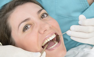 Woman getting a dental exam