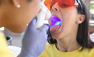 Patient receiving oral cancer screening