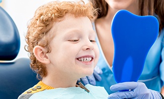 Smiling little boy in dental chair