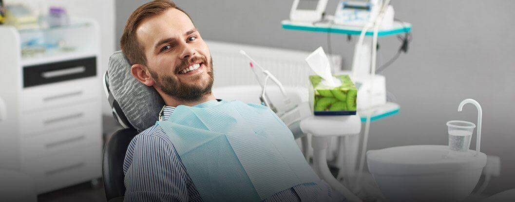 Smiling man in dental chair