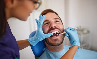 Male patient recieving dental treatment