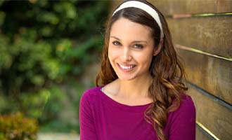 Woman smiling with veneers in Westminster