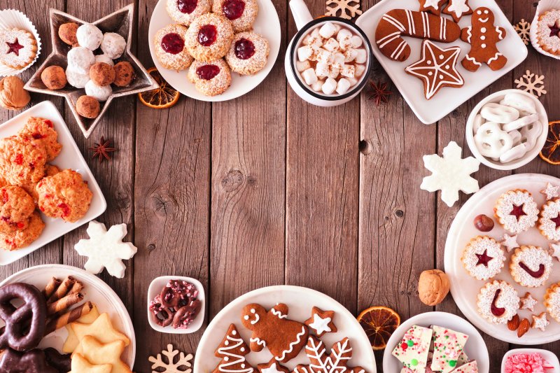 a table full of holiday cookies and treats 