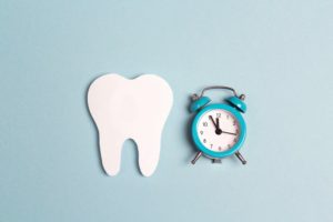 tooth next to a clock