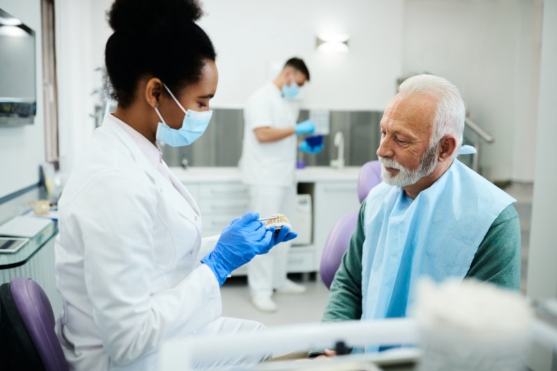 male patient learning about dentures