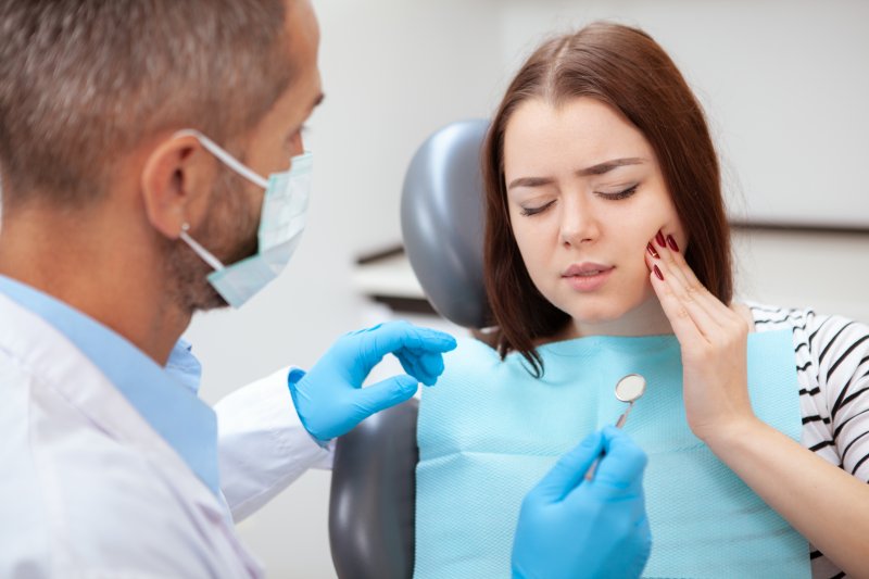 young woman with a dental emergency